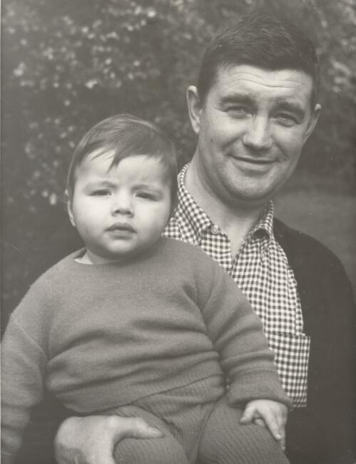Portrait of Leonard French holding a child, Beaumaris, Victoria, 1964 [picture]