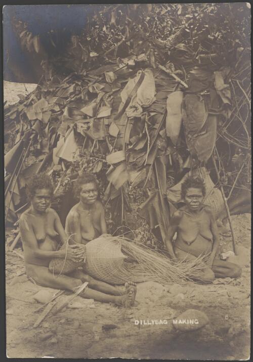 Three Aboriginal women making dilly bags in front of a palm leaf shelter, Queensland, ca. 1900 [picture] / Handley & Atkinson Photographers
