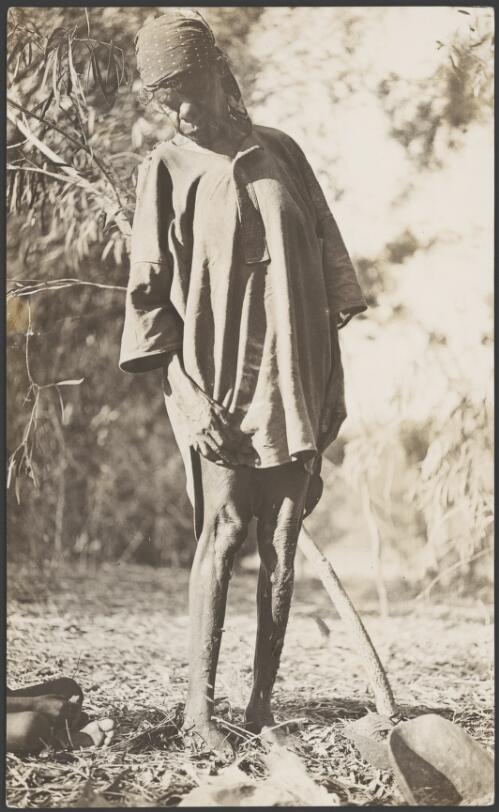 Aboriginal woman wearing a man's shirt and bandana, 1914 [picture] / Frank Hurley