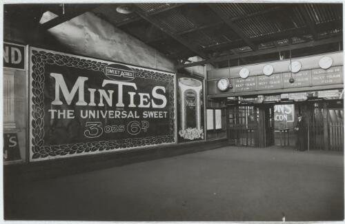 Billboard advertising Minties lollies inside a railway station, Melbourne, Victoria, approximately 1925
