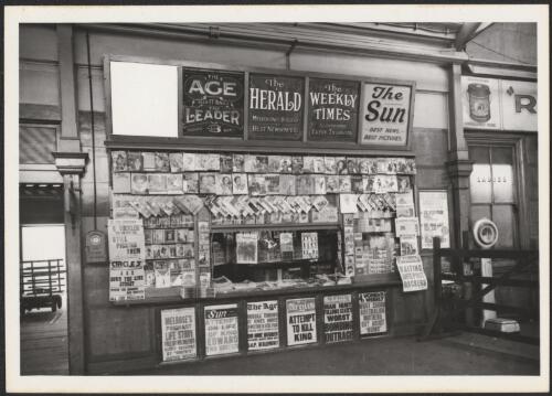 Newspaper stand in a railway station headlining attempt to kill King, Victoria, 1936, 1