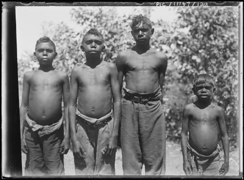 Group portrait of four Aboriginal boys at Hermannsburg Lutheran Mission Station, Northern Territory, 1911 [picture]
