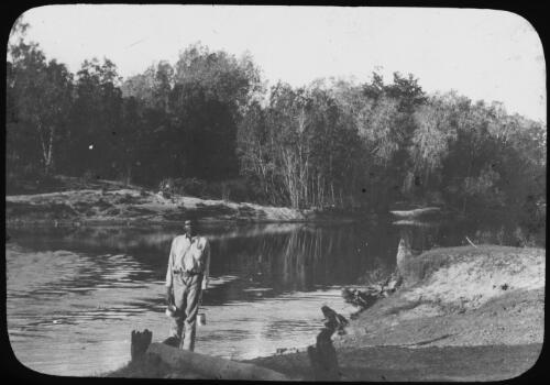 An Aboriginal Australian man standing on the riverbank of Pine Creek, Northern Territory, 1911 [picture]