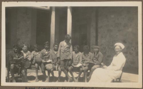 Young Aboriginal boys having lessons with Matron outside Koonibba Children's Home, South Australia, probably 1926
