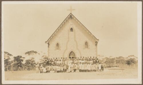 Aboriginal children and congregation staff outside Koonibba Lutheran Church, South Australia