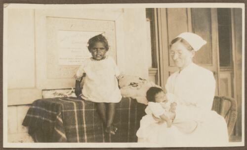 Nurse Semmler with two young children at Koonibba Children's Home, Koonibba, South Australia