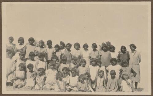 Girls from Koonibba Children's Home grouped on a beach, South Australia