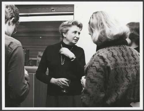 Portrait of Rosemary Dobson talking to three unidentified people at Woden Public Library, Canberra, 1979 [picture]/ Rob Little