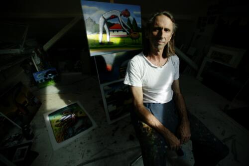 Reg Mombassa in his studio with some of his work, Glebe, New South Wales, 9 March 2005 / Andrew Quilty