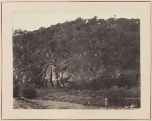 Woman standing near a rocky outcrop near Port Lincoln?, South Australia, approximately 1880 / Samuel Sweet