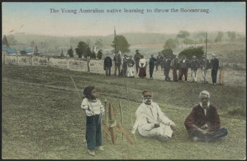 Aboriginal boy standing near two old men, one is holding a boomerang, Coranderrk, Healesville, Victoria