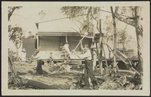 Family clearing the land in front of their house, Australia, approximately 1910