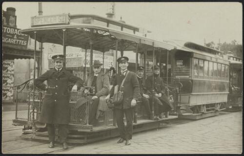 Melbourne tram conductors in front of a cable tram, Victoria, between 1924 and 1940