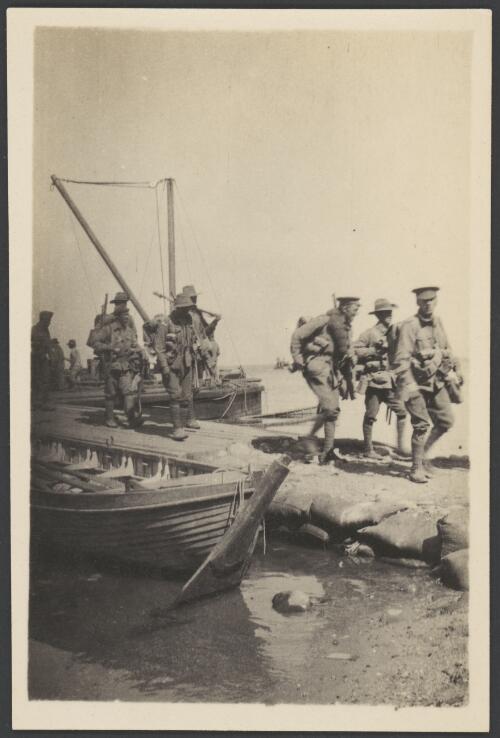 Troops disembarking from lifeboats onto a wharf, Gallipoli, Turkey, probably 1915