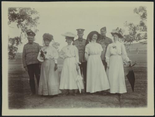 Four women with three men in uniform, Yarralumla Homestead, Canberra, 1909