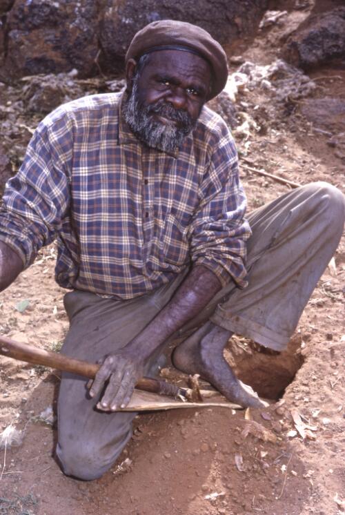 Pitjantjatjara man Billy Kaypipi making a woomera from mulga wood, Ernabella, South Australia, 1967 / Robin Smith