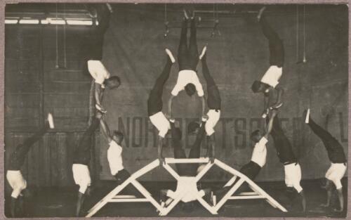 Acrobats balancing on a wooden frame at the internment camp at Holsworthy, New South Wales, 1918 or 1919 / Carl Schiesser