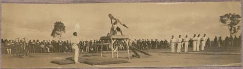 Gymnasts performing on vaulting equipment outside at the internment camp at Holsworthy, New South Wales, 1918 or 1919 / Carl Schiesser