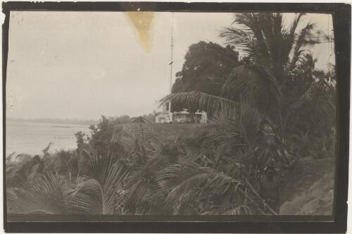 Flag pole in front of a house, Rabaul, New Guinea, 1914. approximately 1914