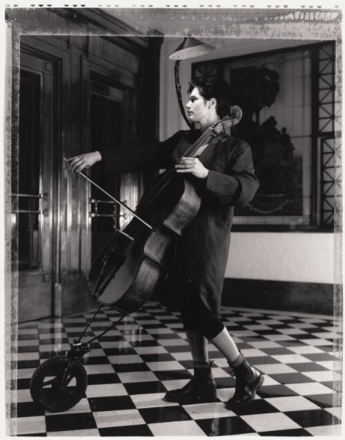 Circus Oz performer Julie McInnes playing the cello, Melbourne, 1997 / Jim Rolon