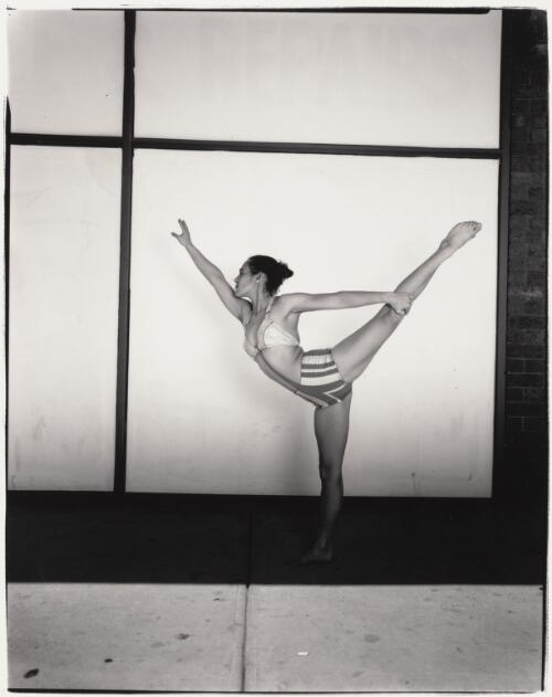 Zanette Clements, Circus Oz performer, doing an arabesque, Melbourne, 1997 / Jim Rolon