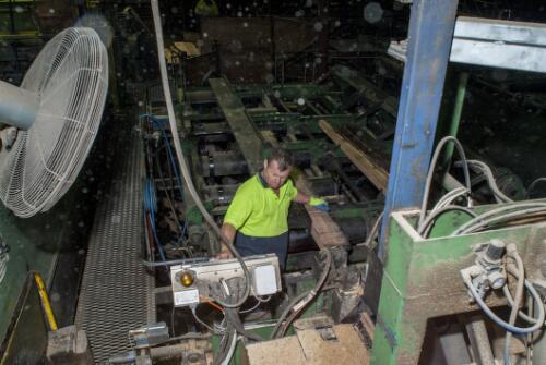 Saw mill worker Dean Loader, operating equipment at Blue Ridge Hardwoods saw mill, Eden, New South Wales, 2011 / Ruth Maddison