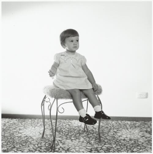 The Kerry's family girl toddler sitting on a chair, Winston Hills, New South Wales, 1973 / Mervyn Bishop