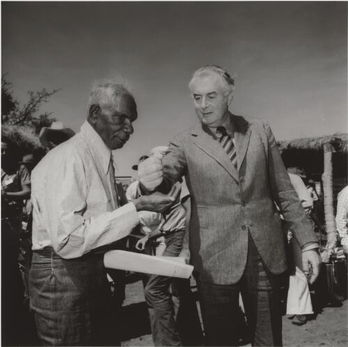 Prime minister Gough Whitlam pours soil into the hand of Gurindji Traditional Land Owner Vincent Lingiari at Wattie Creek, Northern Territory, 16 August 1975 / Mervyn Bishop