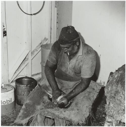 Eric Maynard cleaning a mutton bird, Great Dog Island, Tasmania, 1975 / Mervyn Bishop