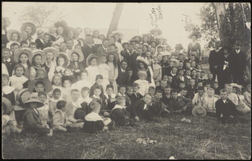 School children and teacher on the picnic ground on Empire Day, Murrumbateman, New South Wales, approximately 1910