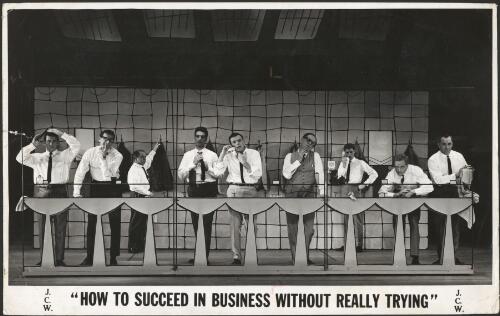 Len Gochman (centre) and male cast members in the J.C. Williamson production of How to succeed in business without really trying. The executives washroom scene, 1963 [picture] / Allan Studios