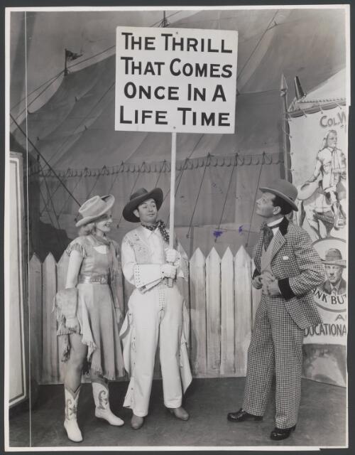 Elizabeth Gaye as Winnie Tate, Billy Kershaw as Tommy Keeler and Carl Randall as Charlie Davenport in the J.C. Williamson production of Annie Get Your Gun, 1947-1948, Act 1, Scene 3, Fairgrounds [picture] / Ritter Jeppesen Studios, Melbourne [picture] / Ritter Jeppesen Studios, Melbourne