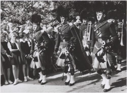 The Black Watch Band marching in street, Newcastle, 1951 [4] [picture] / Newcastle Sun