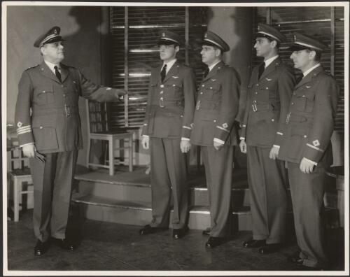 Five unidentified male actors in Air Force uniforms in the J.C. Williamson production of Idiot's delight, 1939 [picture] / C.J. Frazer