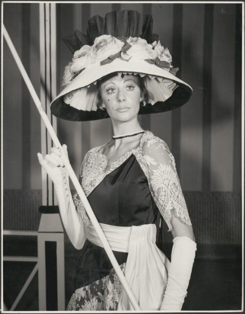 Elana Braianis in a dress featuring black satin with white lace, costume for the Ascot scene in the J.C. Williamson production of My fair lady, 1970 [2] [picture] / Hugh Fisher