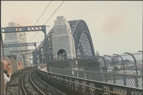 Locomotive 8649 approaches Sydney Harbour Bridge with UP special train ex Newcastle after ceremonial recommissioning of locomotive 3801 at state dockyard, Sydney, 1986 [picture]