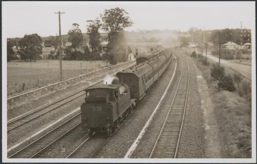 Locomotive 3138 hauling local train towards Sydney passing train no 25 to west, photographed near Seven Hills, 06 October 1947 [picture]