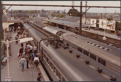 Single deck stainless steel electric train at platform 4 and a double deck stainless steel electric train at platform 3 at Hornsby, New South Wales, 14 October 1983 [picture]