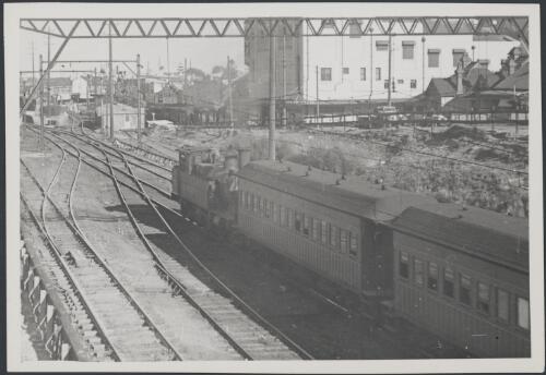 30 class locomotive on local train to Sydney at west end of Auburn station, August 1948 [picture]