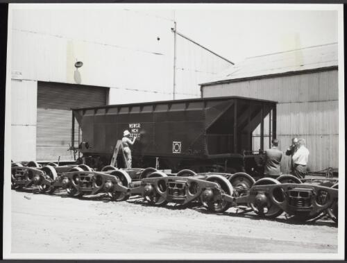Finishing touches are given to 53 tons capacity bogie coal hopper wagon -- one of 150 on order for New South Wales Government Railways from the Clyde Engineering Co. Pty. Ltd., Sydney. [picture]