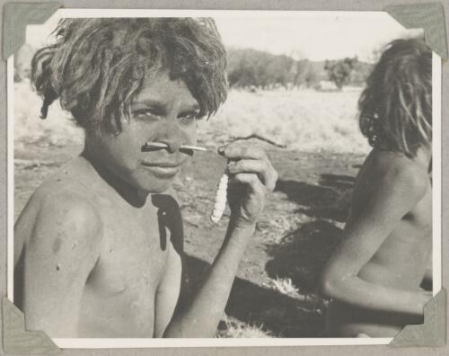 Aboriginal child with a witchetty grub, Ernabella, South Australia, ca. 1946 [picture]