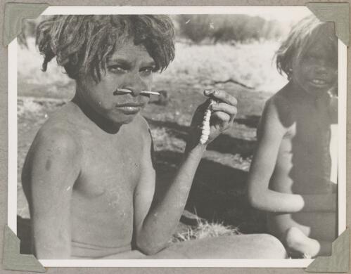 Aboriginal child holding a witchetty grub, Ernabella, South Australia, ca. 1946 [picture]