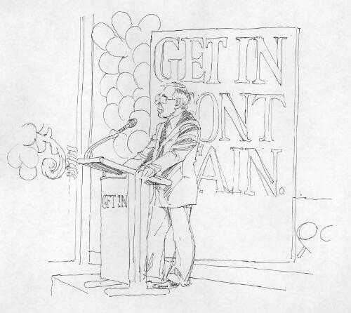 [Speaker at microphone in front of a banner reading "Get in front again".] [picture]