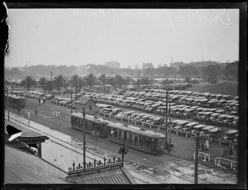 Trams and cricket patrons' cars in the carpark adjacent to the Sydney Cricket Ground, Moore Park, New South Wales, ca. 1920 [picture]