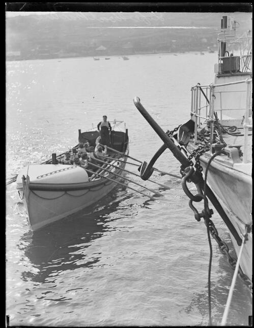 Volunteer crew of the Watsons Bay lifeboat Alice Rawson under the direction of Captain Charles Pike passing the pilot steamer Captain Cook II on Sydney Harbour, New South Wales, May 1930 [picture]