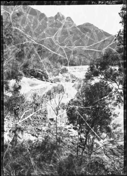 Glimpse in Ramsay Bay, Mount Bowen and The Thumb in background[Hinchinbrook Island, Queensland] [picture] / [Frank Hurley]