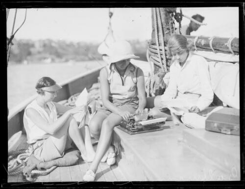 Three people onboard the yacht Gullmarn preparing for departure, New South Wales, 29 April 1932, 1 [picture]
