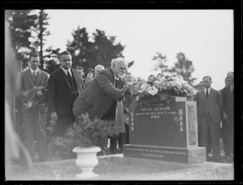 Mr. A.W. Green OBE placing a wreath on the headstone for cricketer Archie Jackson at the Field of Mars Cemetery, Ryde, New South Wales, 3 September 1933 [picture]