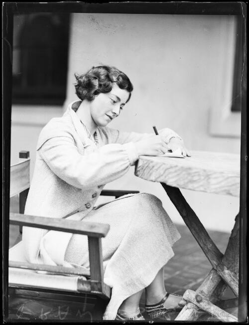 Miss Frances Bult writing at a table, New South Wales, 3 February 1934 [picture]