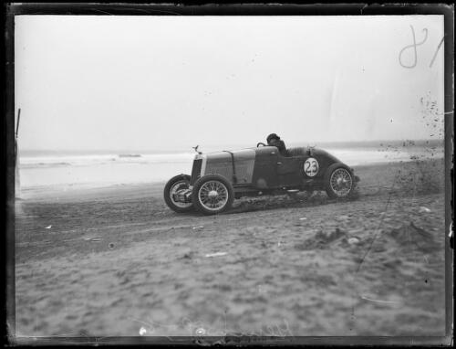 Mr R. G. Potts driving on Seven Mile Beach in the Gerringong Motor Races, New South Wales, 10 May 1930 [picture]